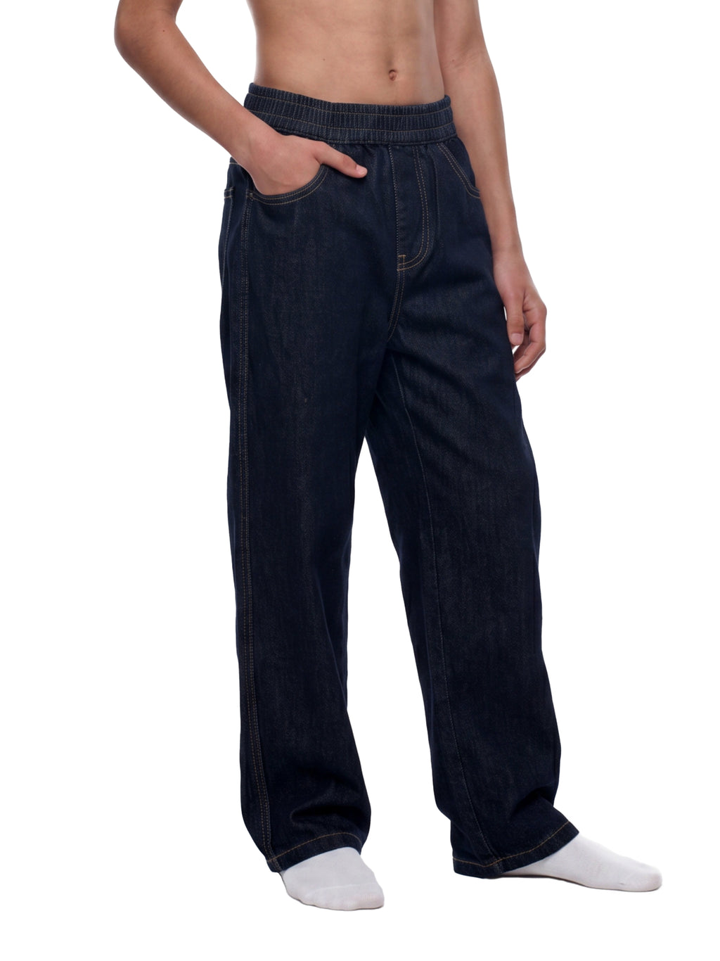 A person wearing loose dark blue denim pants with an elastic waistband, shown from the chest down against a plain white background.