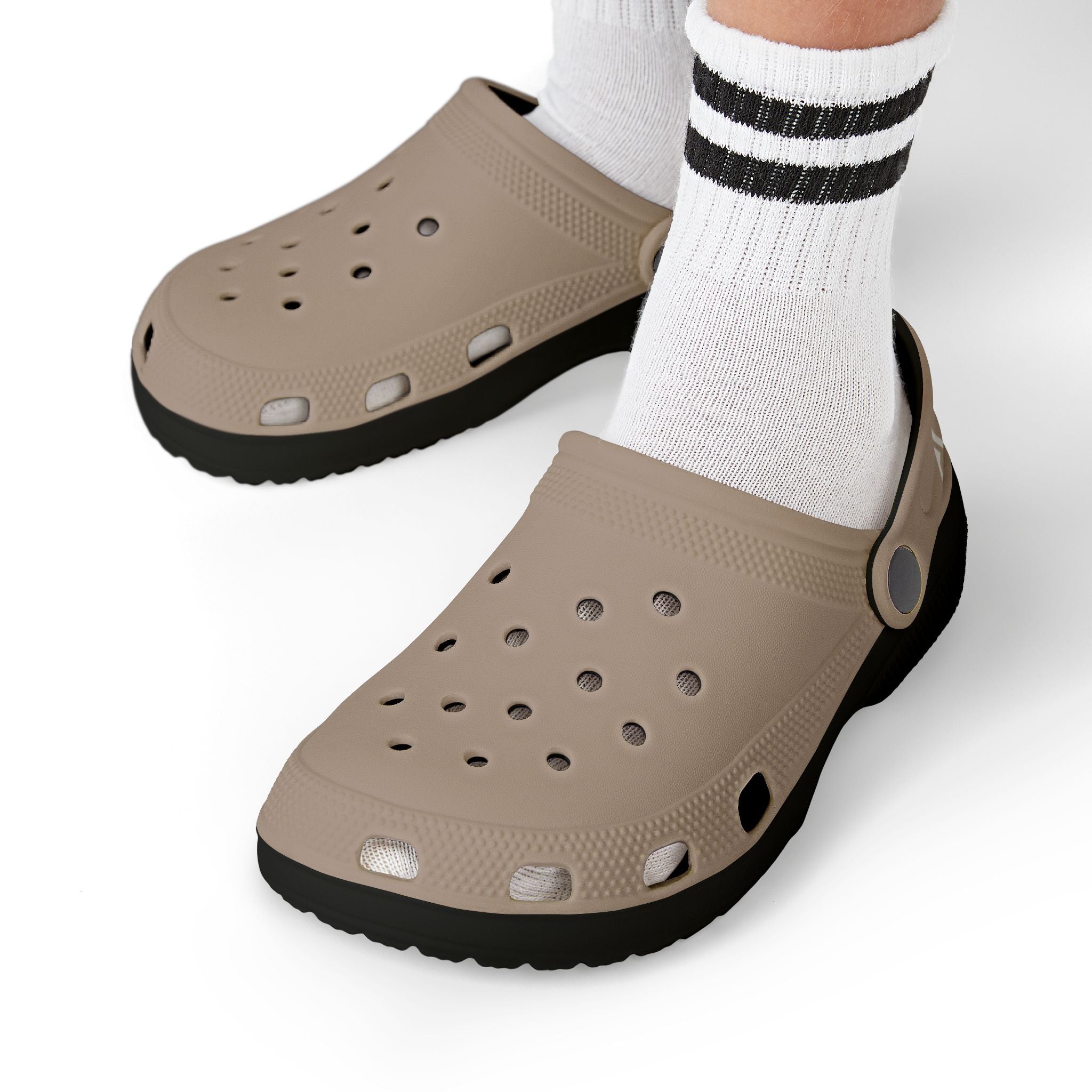 Clogs with fish pattern worn with white socks on a white background